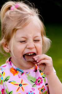 child eating chocolate